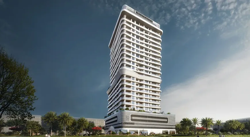 Sanctuary by Prestige One rising above Meydan Horizon at dusk, with landscaped grounds at its base