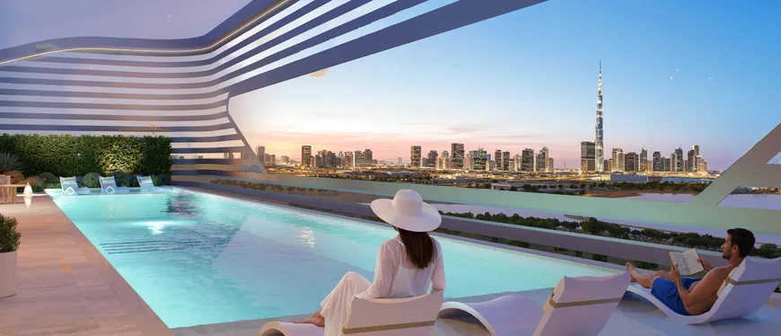 Rooftop infinity pool at Sanctuary looking across the Ras Al Khor wetlands to the Burj Khalifa at sunset